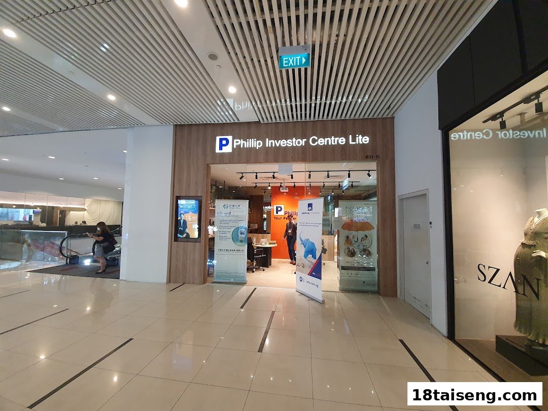 The image shows the modern entrance of Phillip Investor Centre Lite with its prominent signage.