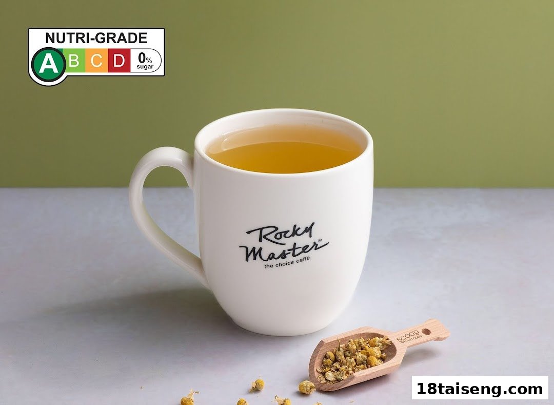 A mug of tea with dried chamomile flowers and a Nutri-Grade A label, from Rocky Master.