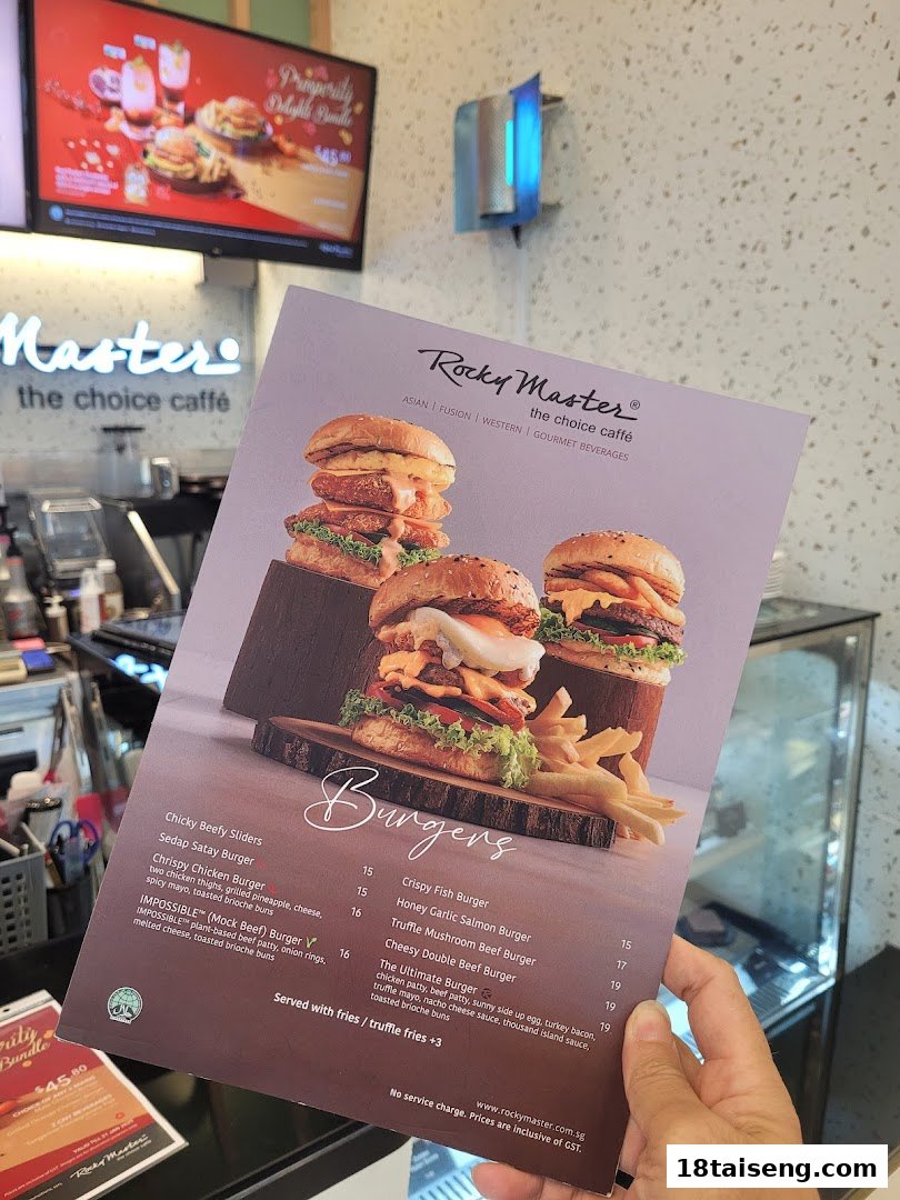 A hand holds a Rocky Master cafe menu, showcasing a variety of gourmet burgers and prices.