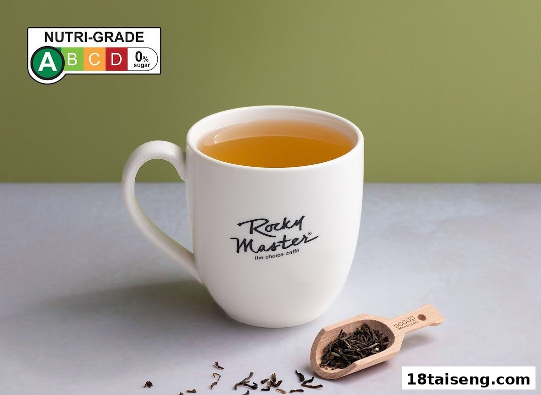 A white mug of tea from Rocky Master with loose tea leaves and a Nutri-Grade A label.
