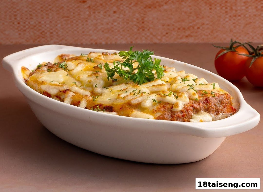 A delicious baked dish, possibly lasagna or shepherd's pie, topped with melted cheese and fresh parsley.