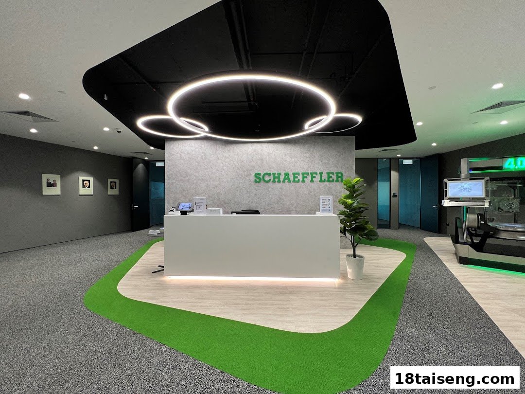 Modern reception area of Schaeffler Singapore featuring a sleek desk and innovative displays.