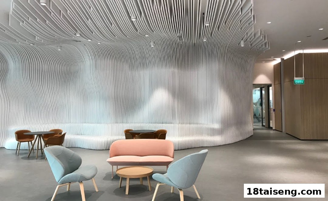 A modern, stylish interior lounge area with wavy white walls and comfortable seating.