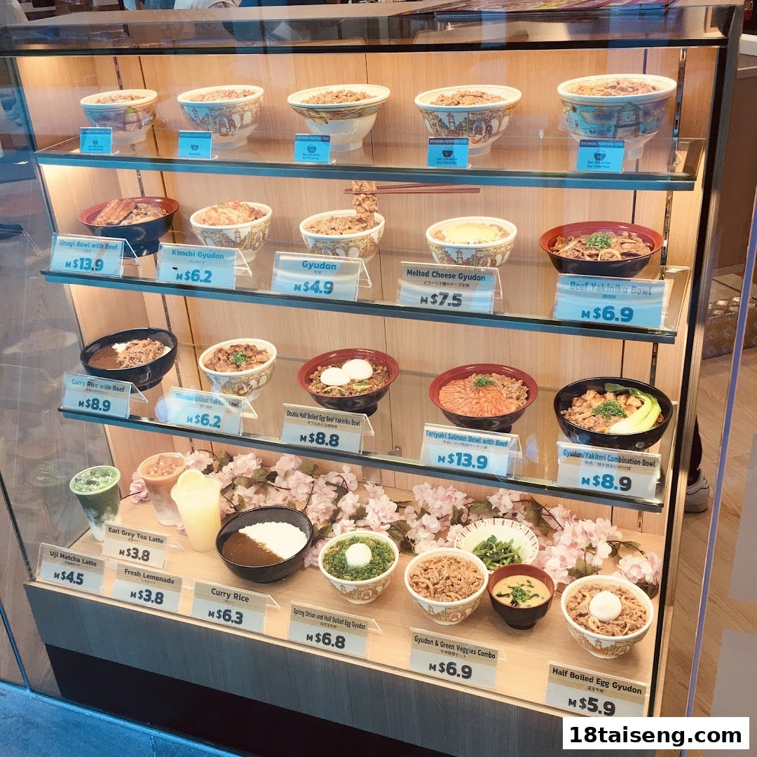 A vibrant display case showcasing Sukiya's delicious gyudon, curry, and other Japanese rice bowls.