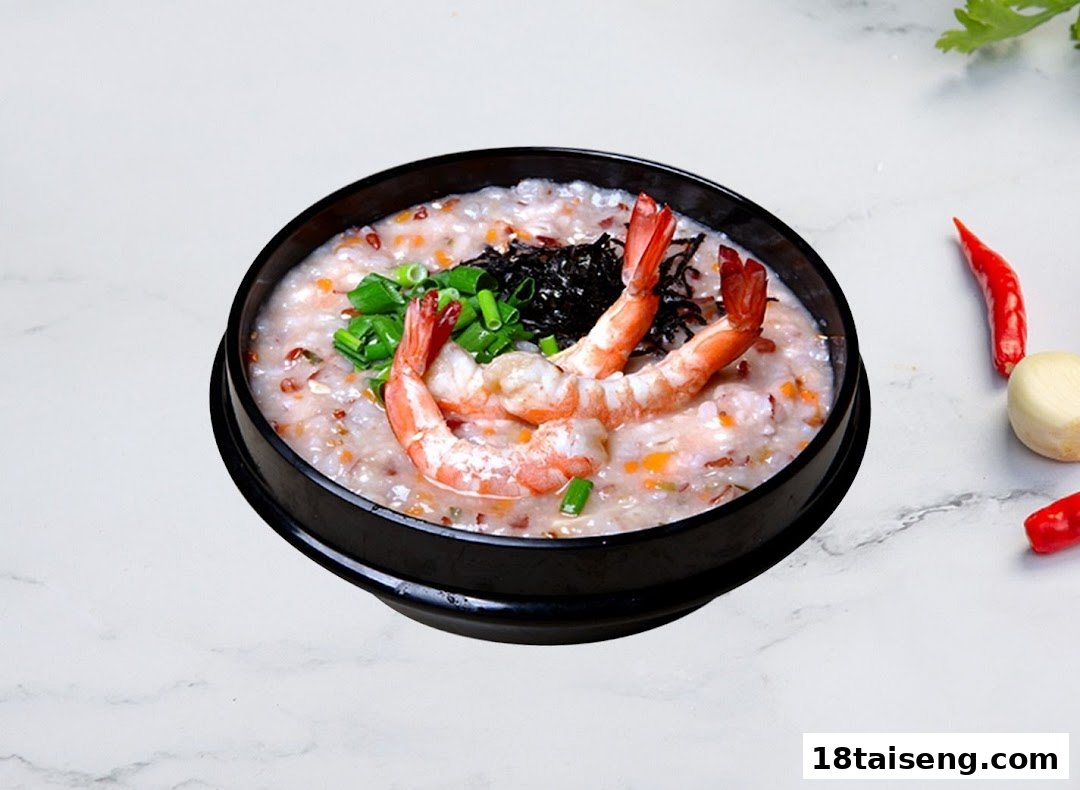 A close-up of a black bowl filled with shrimp porridge, garnished with green onions and seaweed.