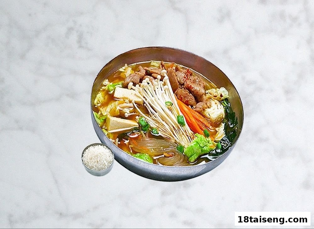 A vibrant Korean hot pot with beef, mushrooms, vegetables, and glass noodles, served with rice.