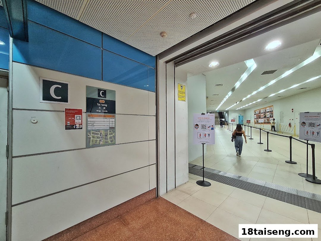 View of Tai Seng MRT Station Exit C, showing a person walking into the station concourse.