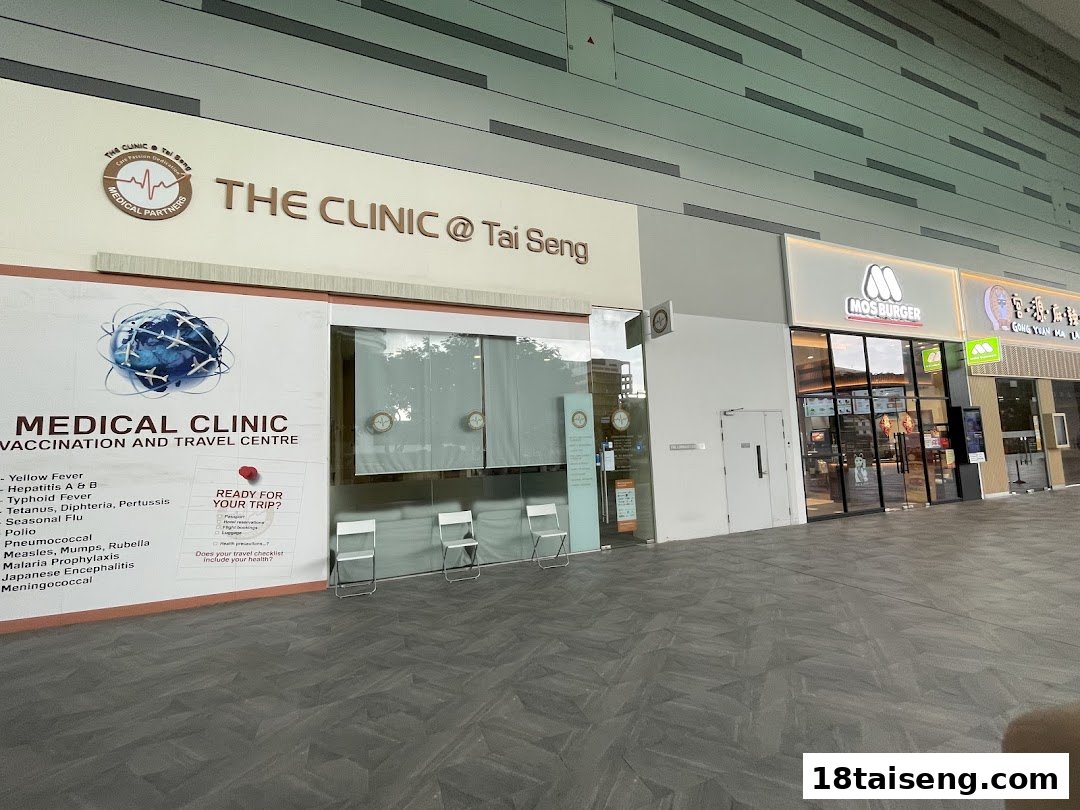The shop front of The Clinic @ Tai Seng, a medical and travel vaccination center, located next to other retail outlets.
