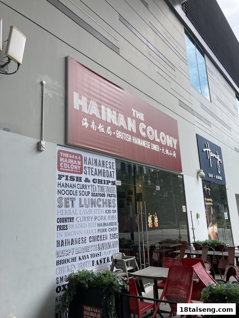 The Hainan Colony shop front features a prominent red sign, outdoor seating, and a large banner listing diverse Hainanese and British-inspired dishes.