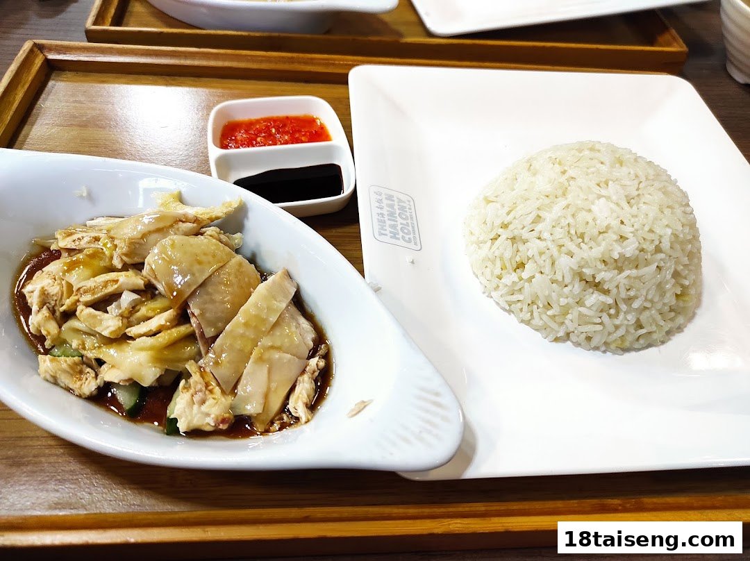 A delicious plate of Hainanese chicken rice with chili and soy sauce from The Hainan Colony.