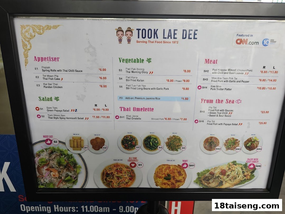 A vibrant menu board showcasing authentic Thai dishes with prices and images at Took Lae Dee.