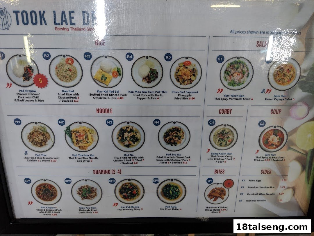 A detailed menu board displaying various Thai dishes with prices from Took Lae Dee.