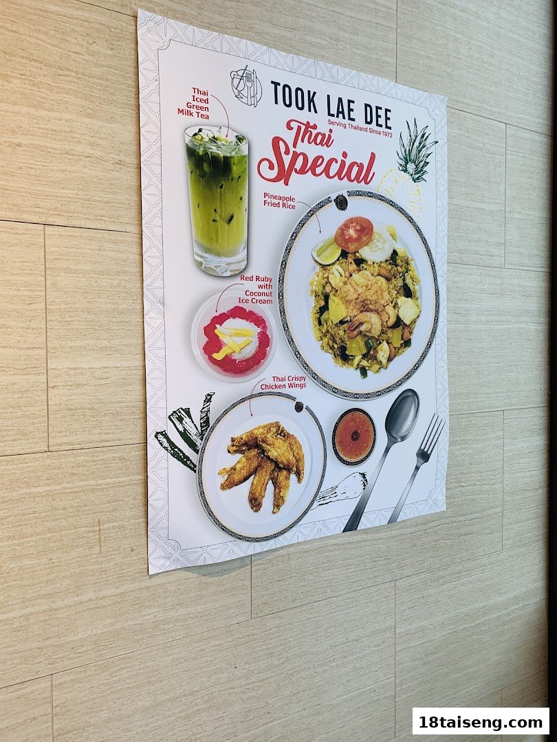 A poster displaying Took Lae Dee's 'Thai Special' menu items including drinks, main courses, and desserts.