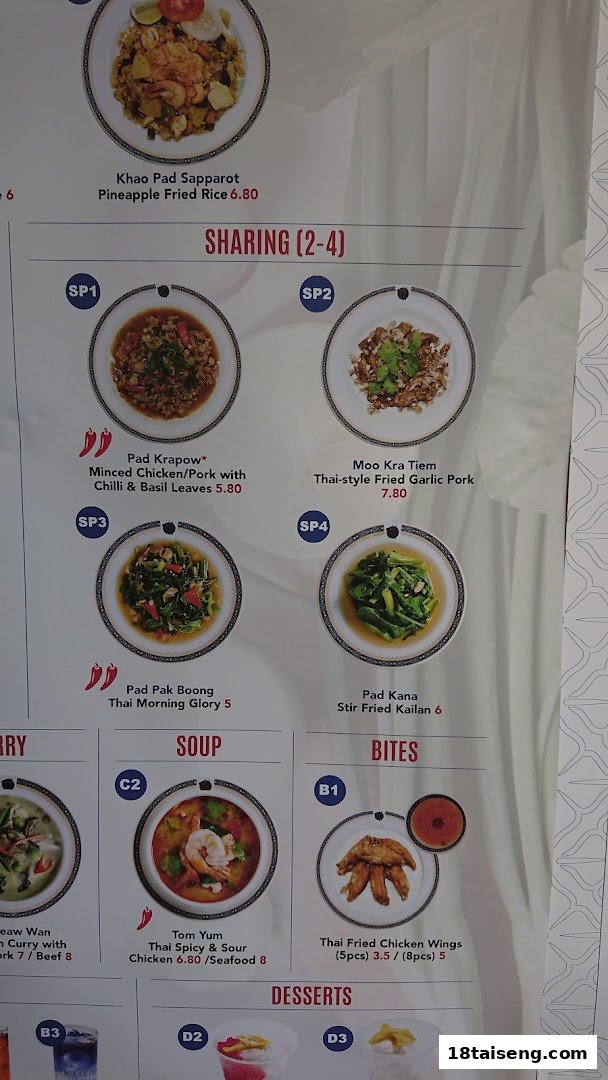 A close-up view of a menu board displaying various Thai dishes with prices and descriptions.