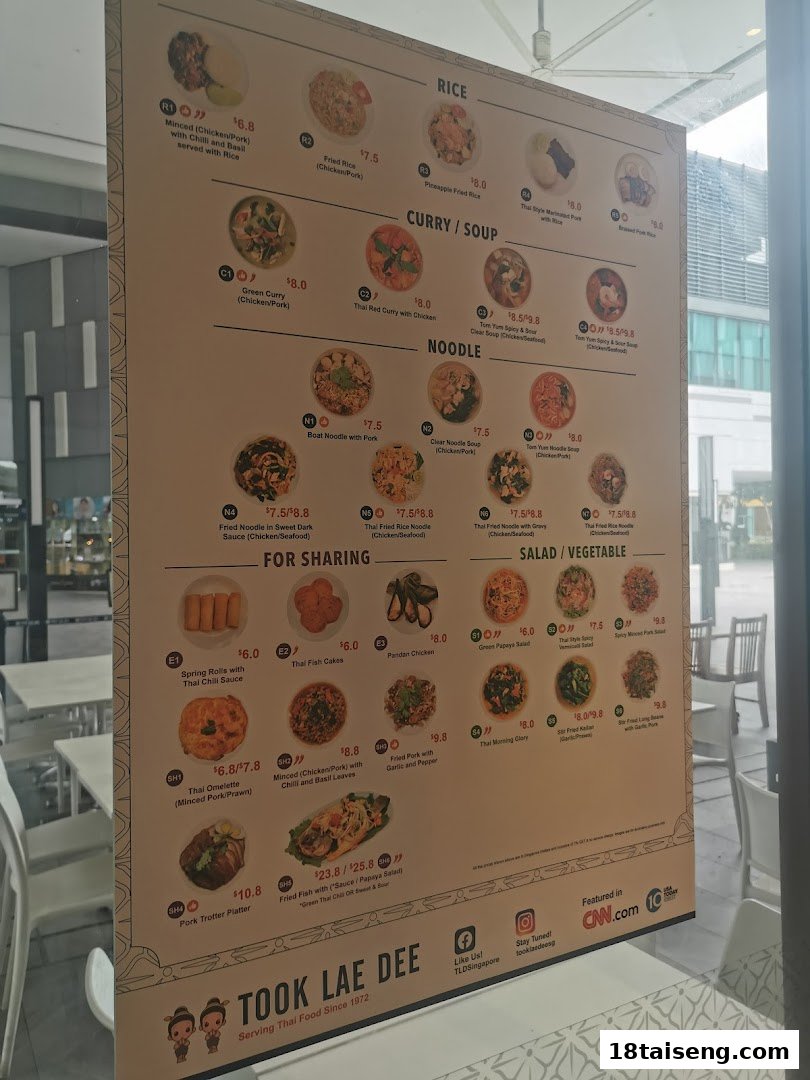 A comprehensive menu board for Took Lae Dee, showcasing a variety of authentic Thai dishes and prices.