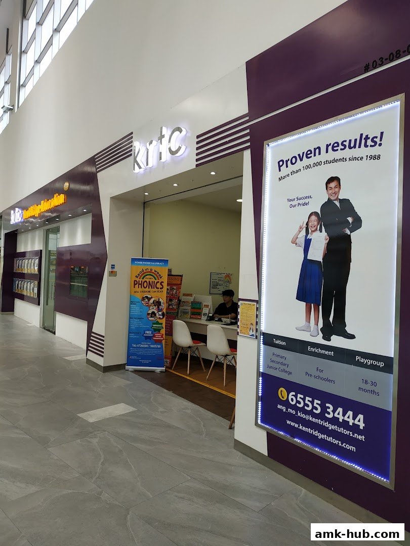 The entrance of KRTC Ang Mo Kio, an education center, with promotional posters and signage.