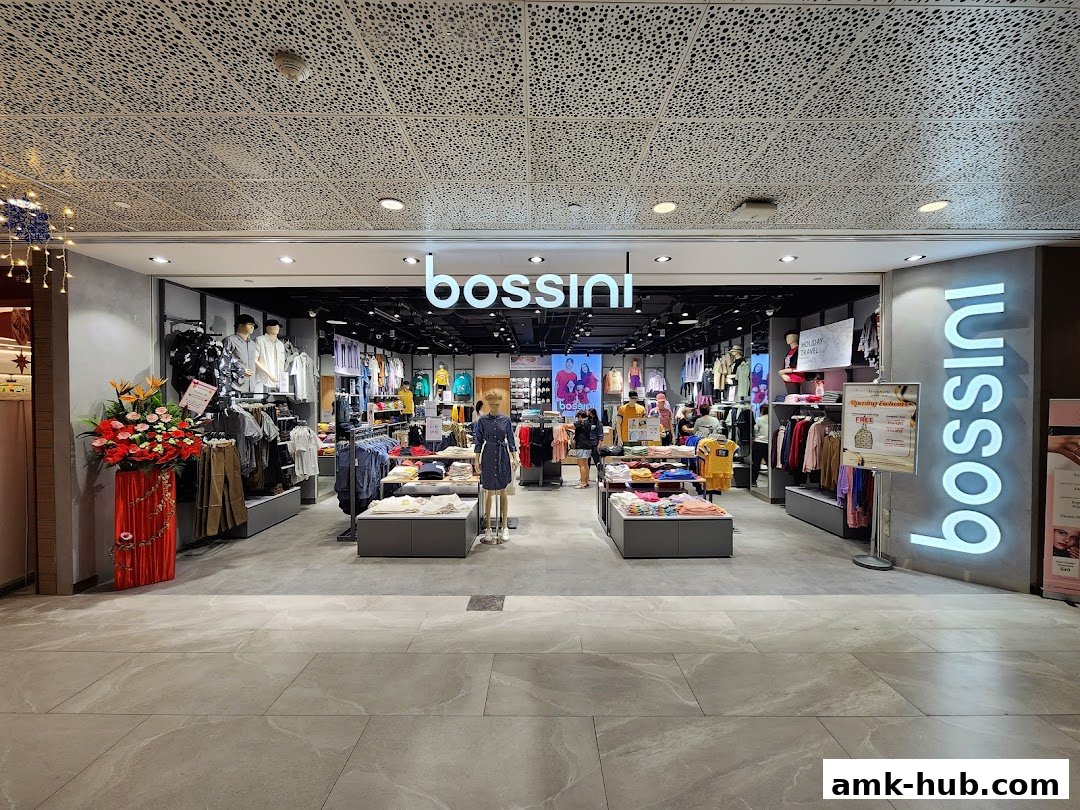 The Bossini store entrance showcasing a variety of clothing on display and mannequins.