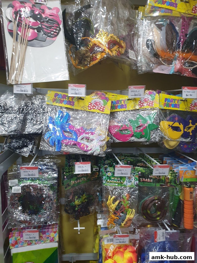 Shelves stocked with various party favors, including masks, photo props, and animal-themed toys.