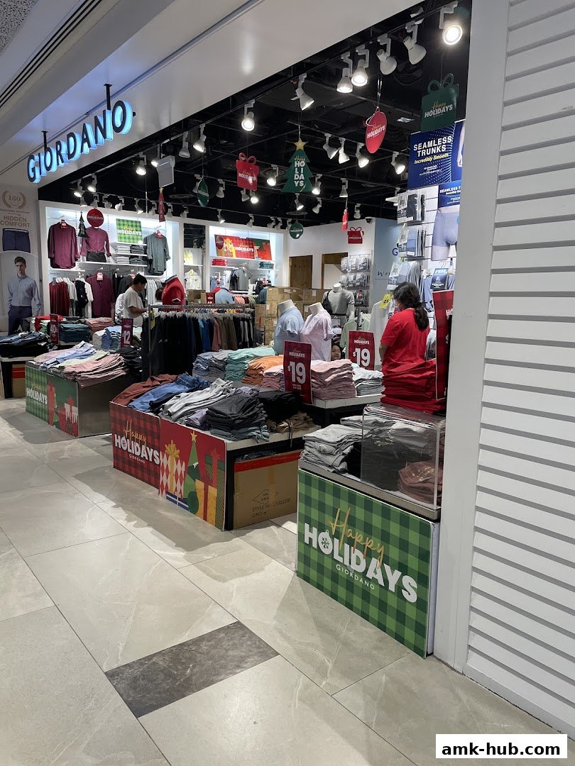 Giordano store interior with clothing displays and holiday decorations.