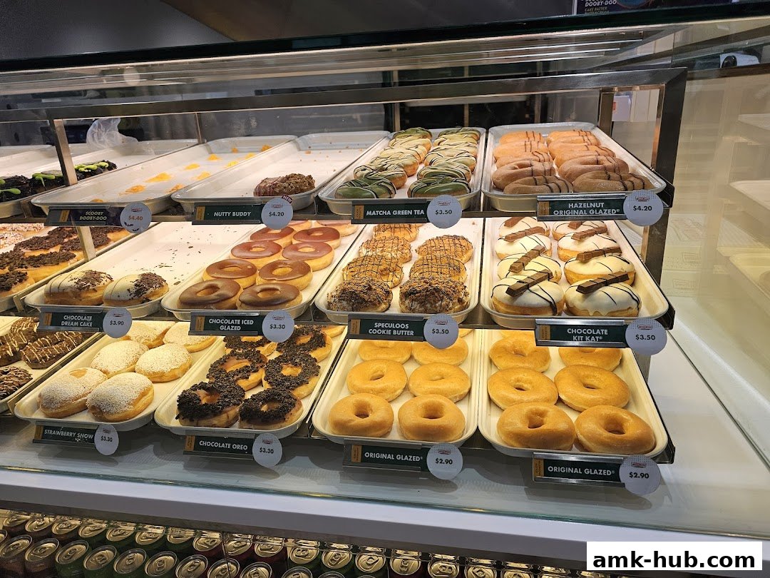 A display case filled with a variety of colorful and delicious donuts.
