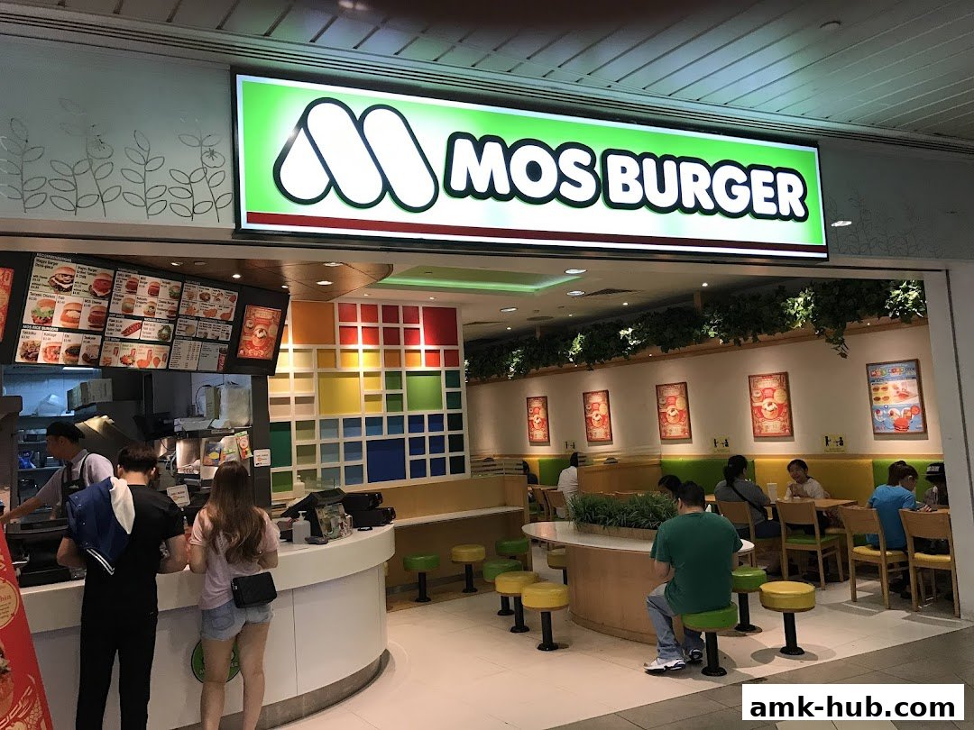 MOS Burger shop interior with customers ordering and dining.