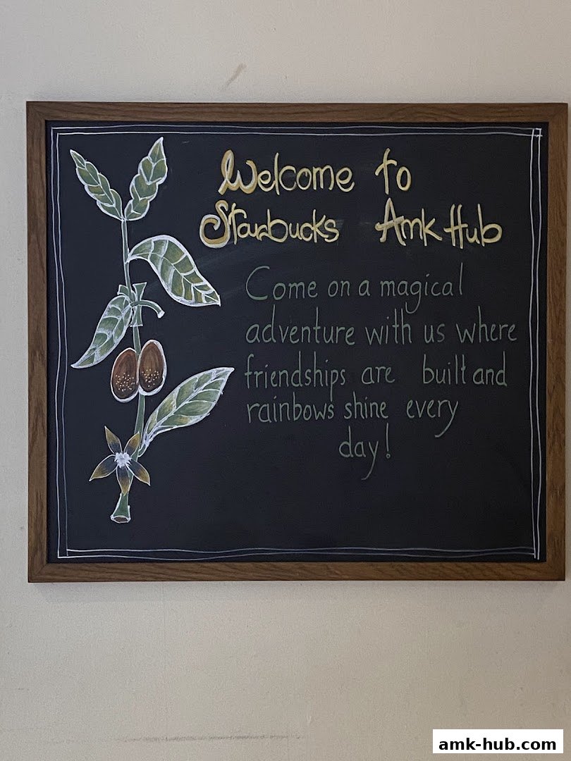 A chalkboard sign at Starbucks Ang Mo Kio Hub welcomes visitors with a cheerful message.