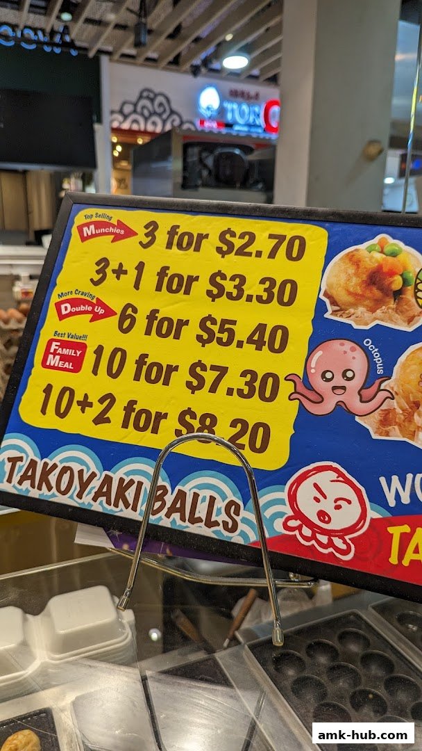 A menu board for Takoyaki Balls with various quantity and price options.