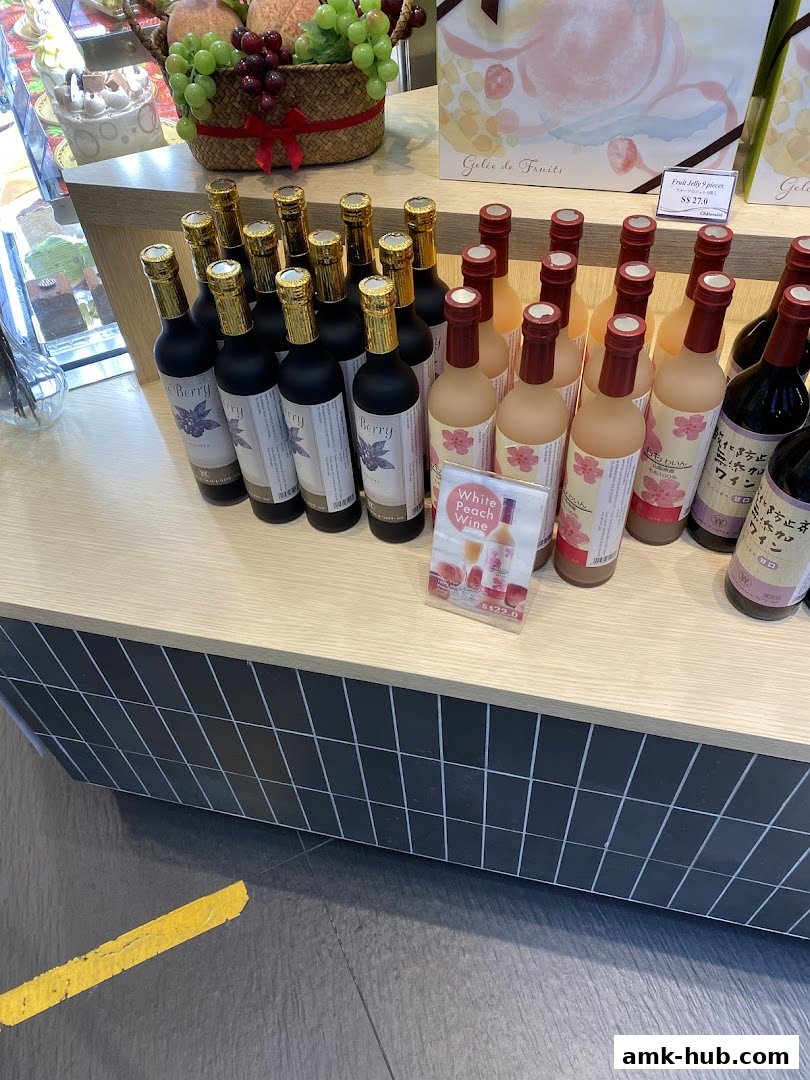Bottles of fruit wine and jelly products displayed on a counter at Châteraisé.