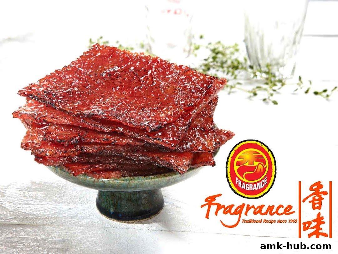 A stack of glistening bak kwa on a pedestal with the Fragrance logo.