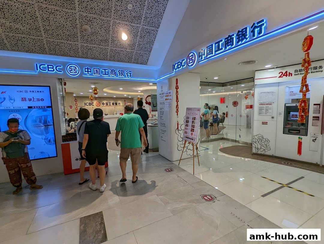 The entrance of ICBC Ang Mo Kio Sub-Branch with people inside and outside.