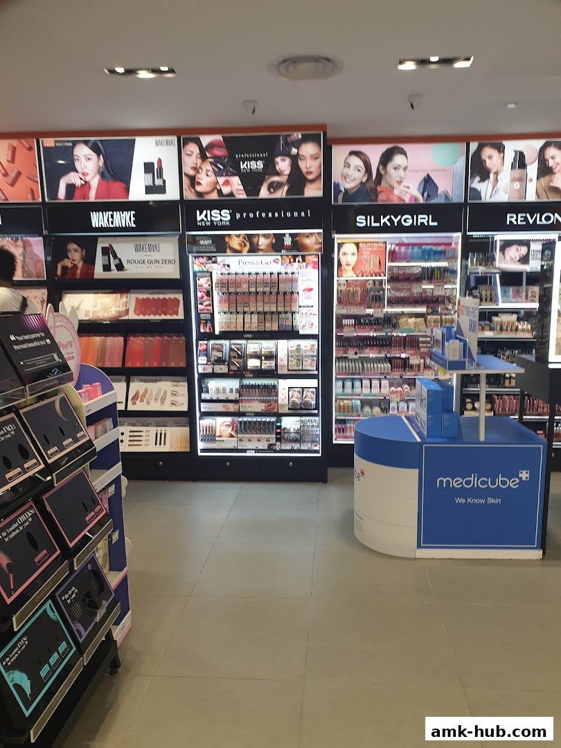 Interior view of a beauty store showcasing various makeup brands and skincare products.