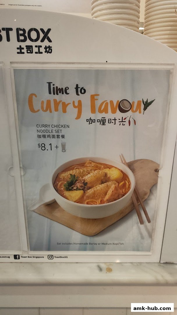 A menu display for Toast Box featuring a Curry Chicken Noodle Set.
