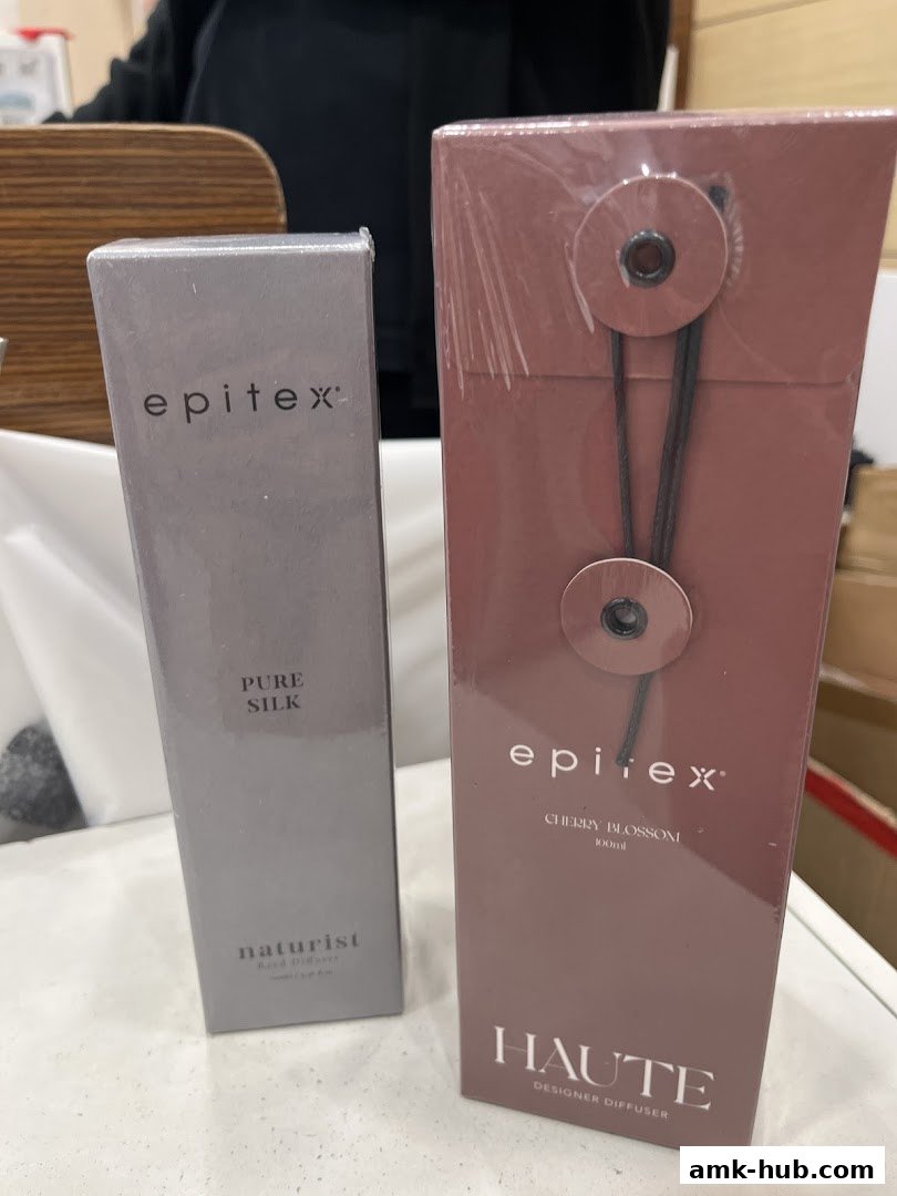 Two Epitex brand home fragrance diffusers, one Pure Silk and one Cherry Blossom.