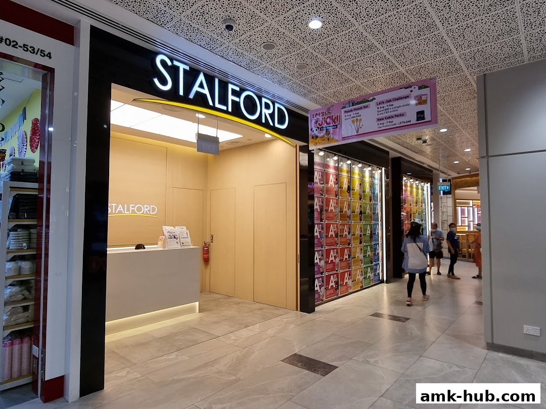 The entrance of Stalford Learning Centre with a reception desk and colorful displays.