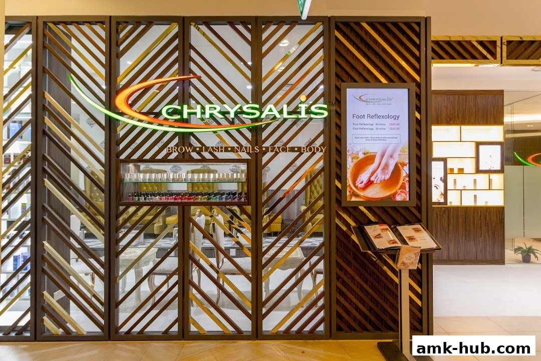 Chrysalis Spa shop front with a display of nail polish and a digital menu.