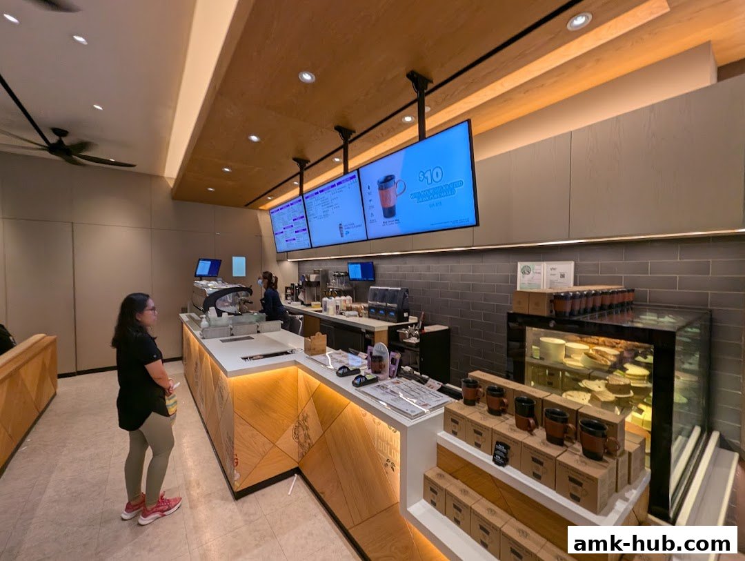Interior view of The Coffee Bean and Tea Leaf shop with customers and staff at the counter.