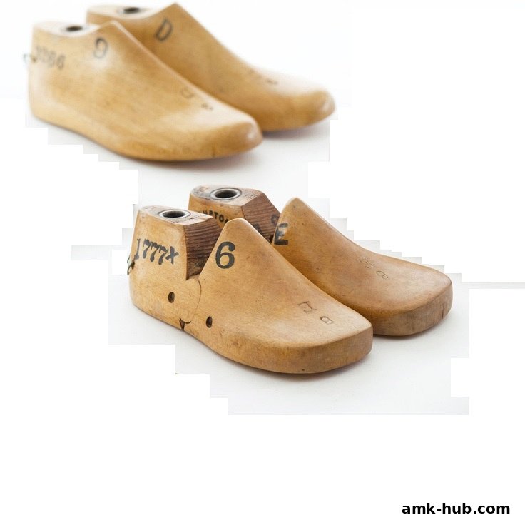 Two pairs of vintage wooden shoe lasts are displayed against a white background.