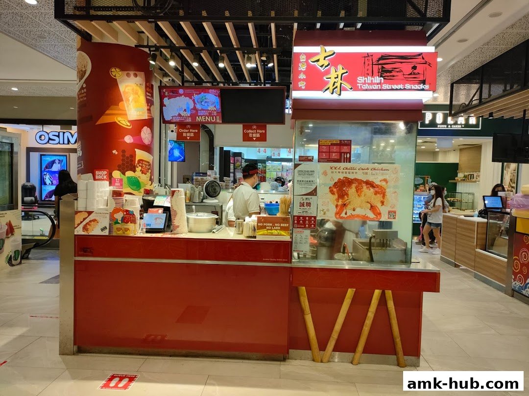 Shihlin Taiwan Street Snacks stall with a prominent red counter and signage.