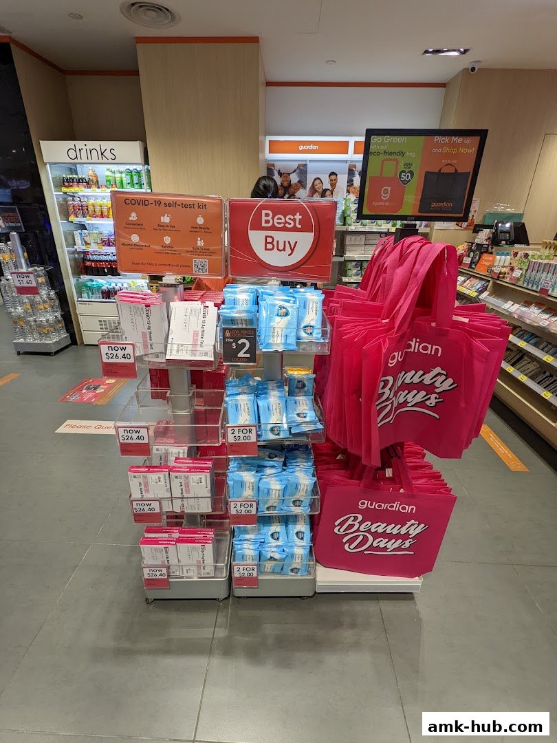 A display of health and beauty products, including COVID-19 test kits and reusable bags, at Guardian.