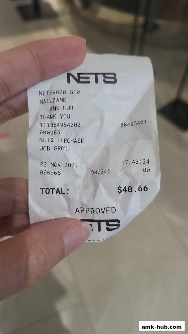 A hand holds a receipt from Nailz Gallery at AMK Hub, showing a total of $40.66.