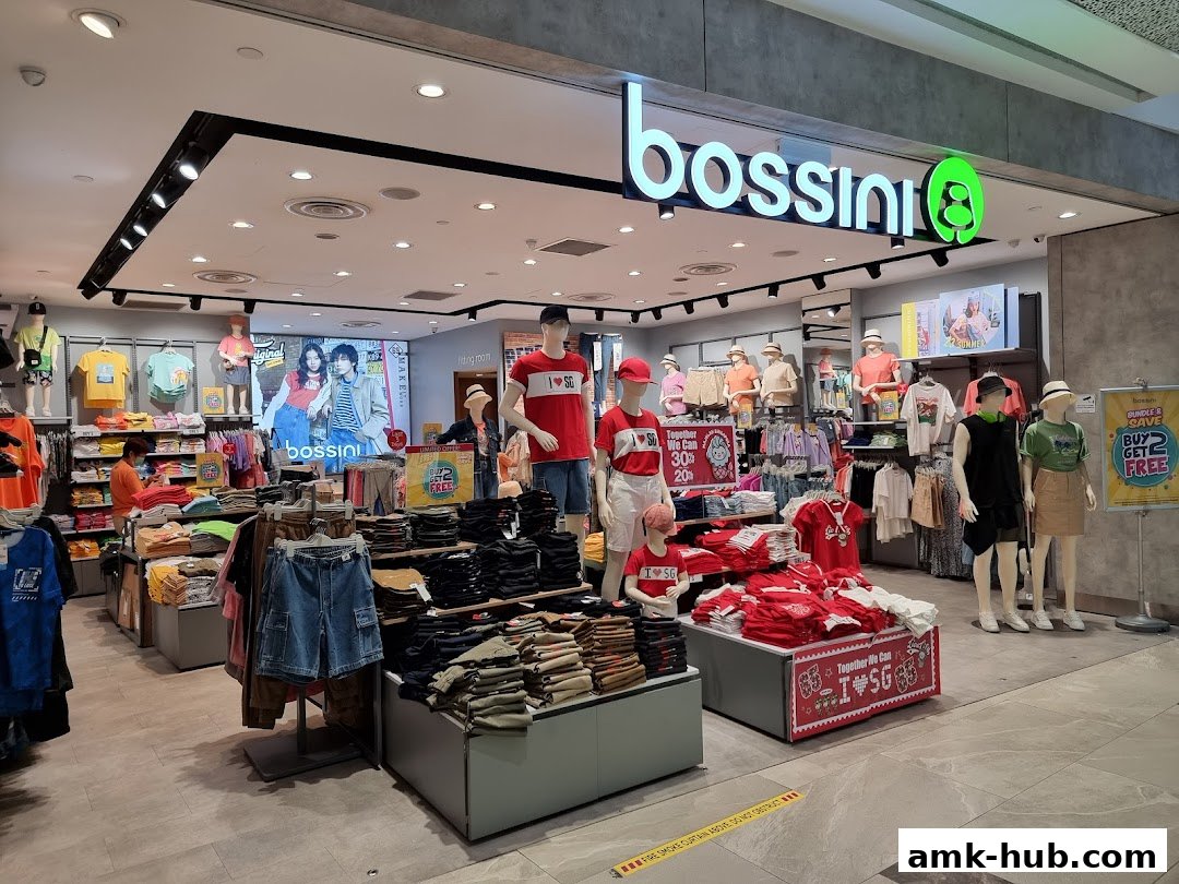 Interior view of a Bossini clothing store with mannequins and apparel displayed.