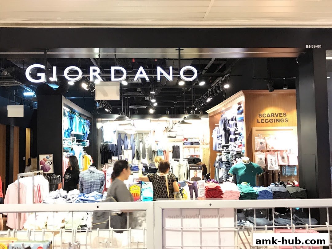 The Giordano store features a well-lit interior with various clothing items displayed on racks and shelves.