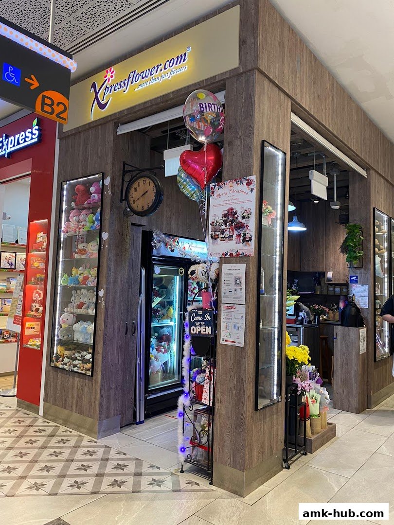 A flower shop called Xpressflower.com with balloons and plush toys displayed.