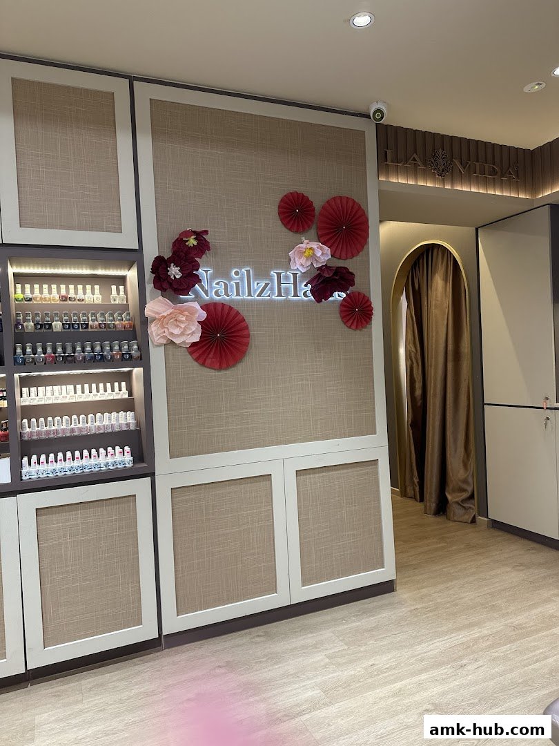 Interior of Nailz Haus AMK, showcasing nail polish displays and decorative elements.