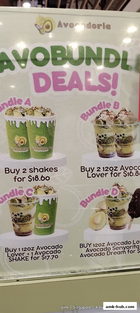 A menu board from Avocadoria showcasing various avocado shake bundle deals with prices.