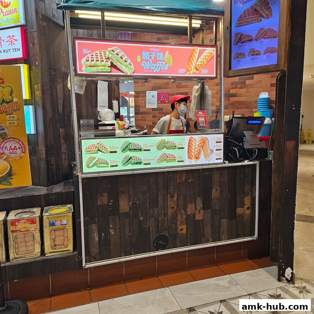 A food stall selling waffles with various fillings and flavors.