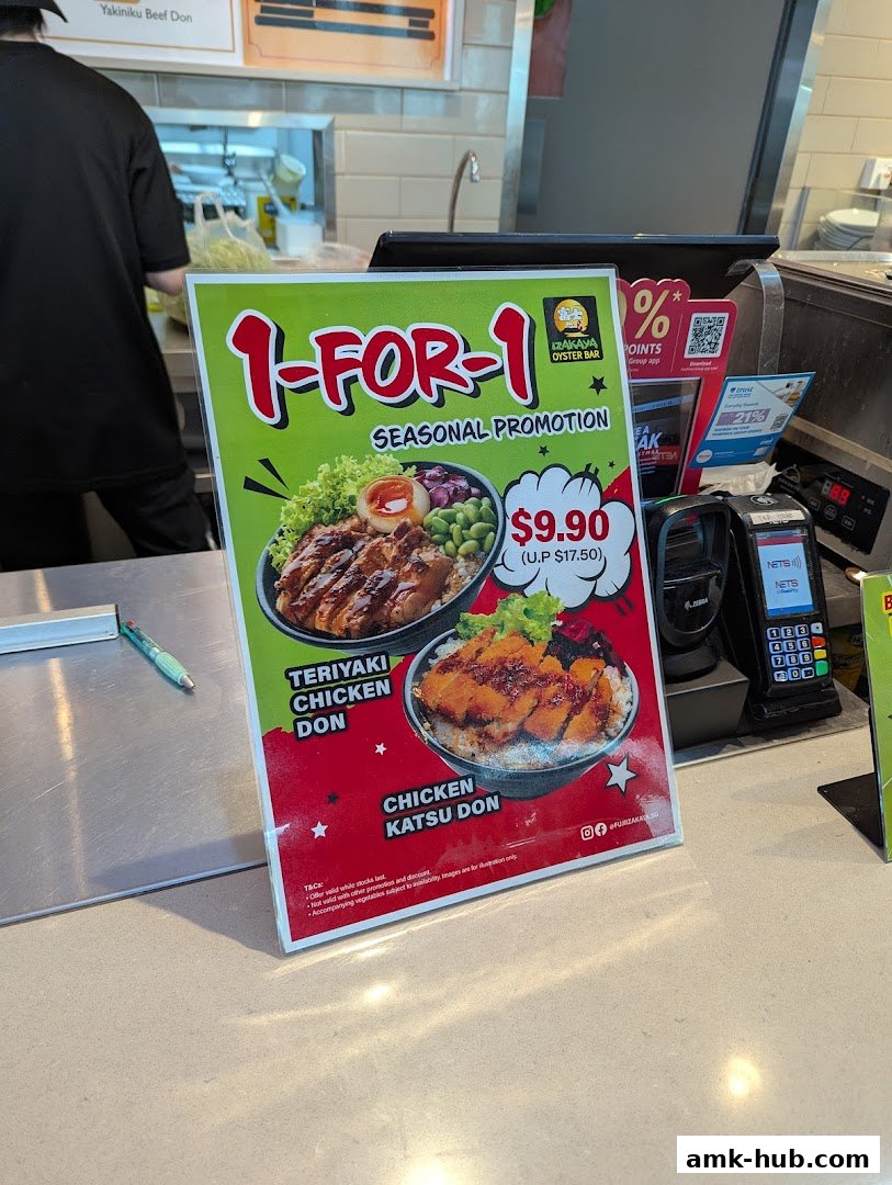 A promotional sign for a 1-for-1 seasonal offer on Teriyaki Chicken Don and Chicken Katsu Don.