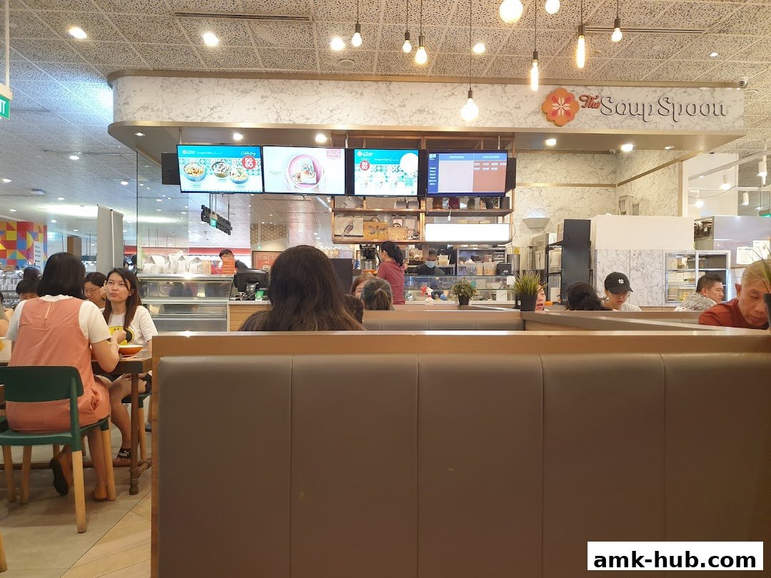 Interior view of The Soup Spoon restaurant with customers dining and a counter area.