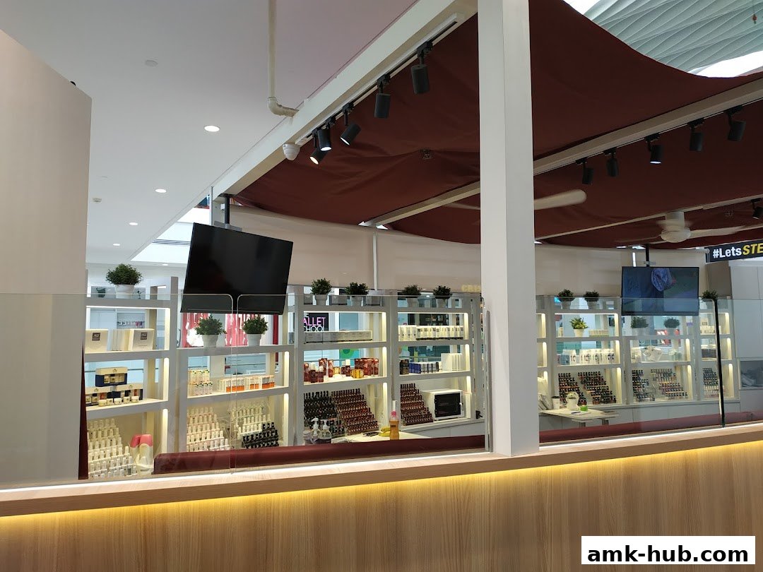 A well-lit retail shop interior with shelves displaying various products and bottles.
