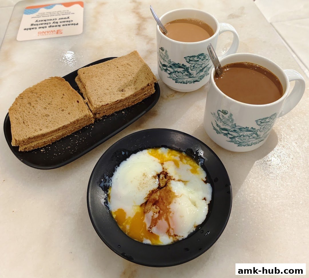 A breakfast spread of soft-boiled eggs, toast, and coffee at Heavenly Wang.